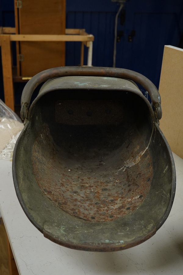 A copper watering can and a helmet coal scuttle, watering can 40cm high. Condition - interior of coal scuttle rusty, both need cleaning